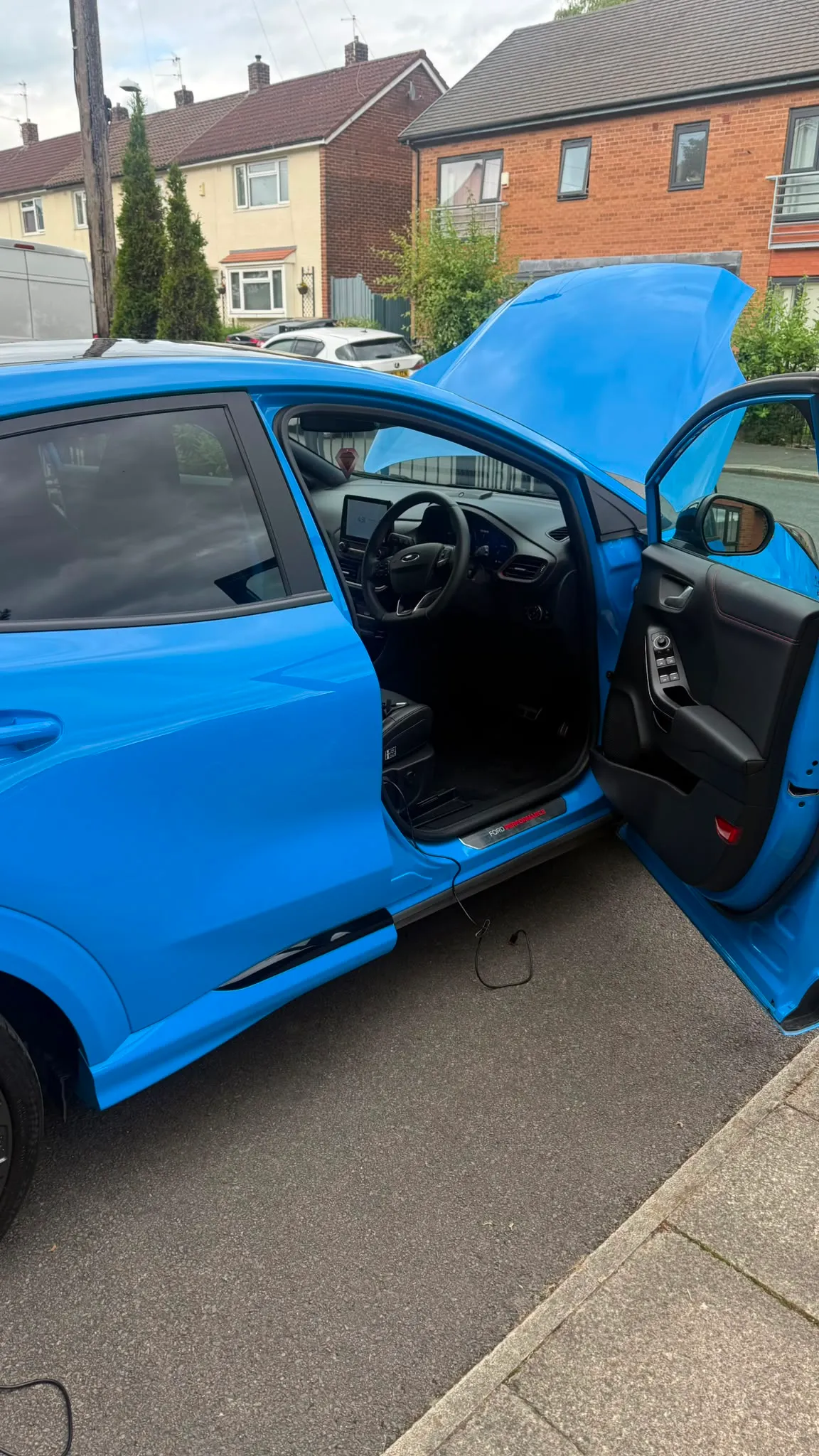 Ford Puma ST. Doors open, OBD lead run into the cabin before the original file is saved.